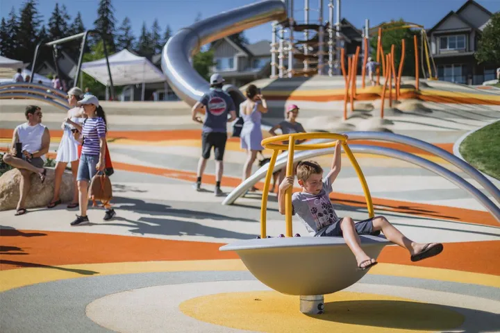 Children playing on playground equipment.